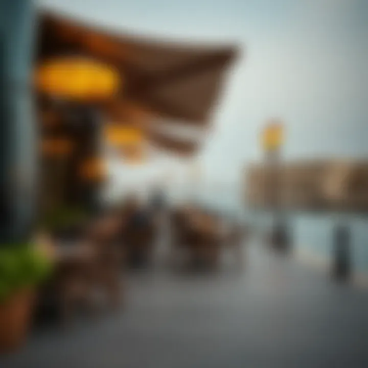 Outdoor Dining by Dubai Creek An outdoor dining area with Dubai Creek in the background