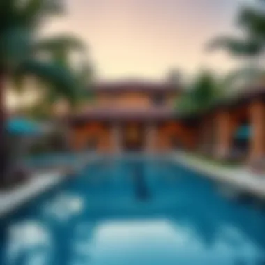 Luxurious swimming pool surrounded by palm trees at Beach Oasis
